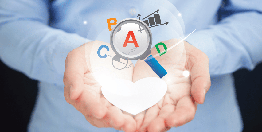 Hands holding digital marketing icons